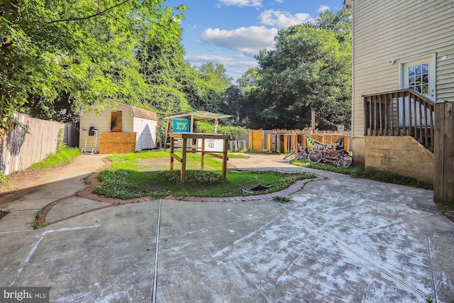 view of yard with a patio area and a shed