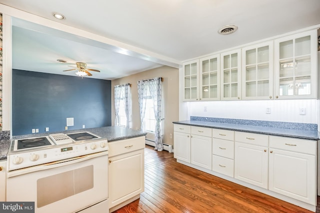 kitchen featuring hardwood / wood-style flooring, white cabinets, ceiling fan, and white electric range oven