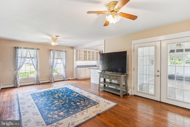 living room with light hardwood / wood-style flooring, ceiling fan, and french doors