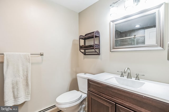 bathroom featuring a baseboard radiator, vanity, and toilet