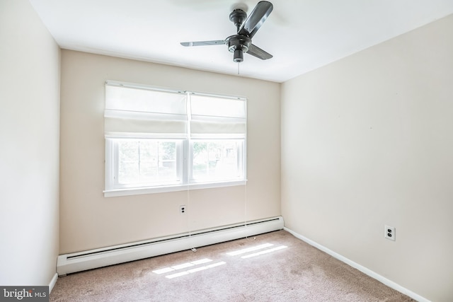 carpeted spare room with baseboard heating and ceiling fan