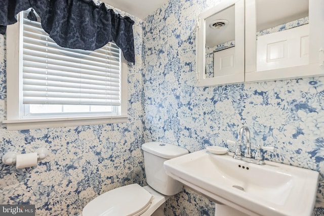 bathroom with toilet and sink