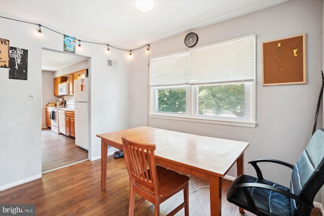 dining area featuring wood-type flooring