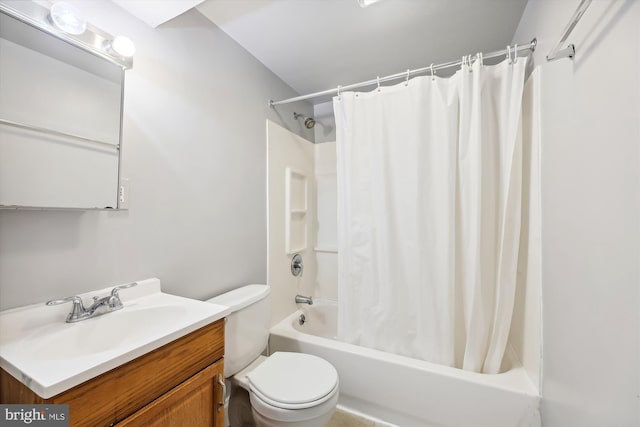 full bathroom with vanity, shower / bath combo, and toilet