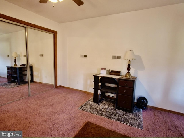 carpeted office featuring ceiling fan