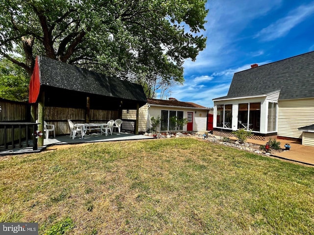 view of yard with a patio area and a sunroom