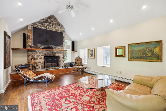 living room with ceiling fan, plenty of natural light, wood-type flooring, and vaulted ceiling