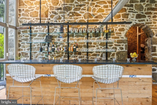 bar featuring hardwood / wood-style floors