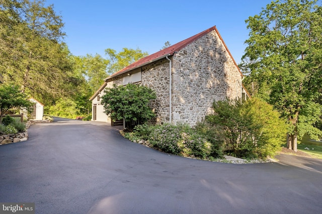 view of side of property featuring a garage