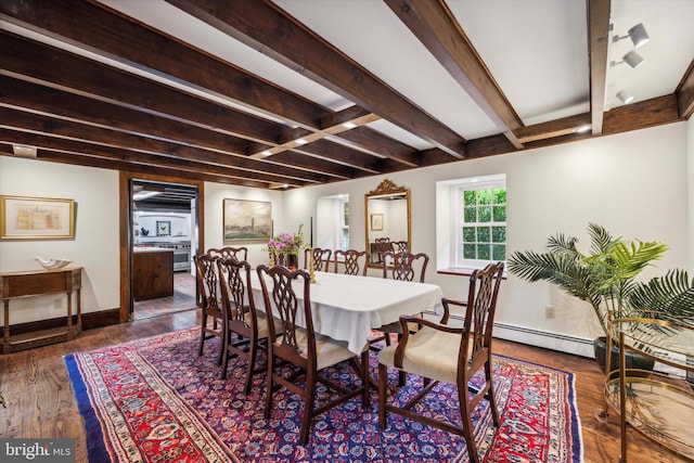 dining space featuring beam ceiling, a baseboard radiator, and dark hardwood / wood-style floors