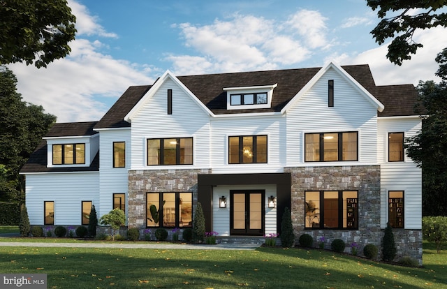 view of front of house featuring stone siding and a front lawn