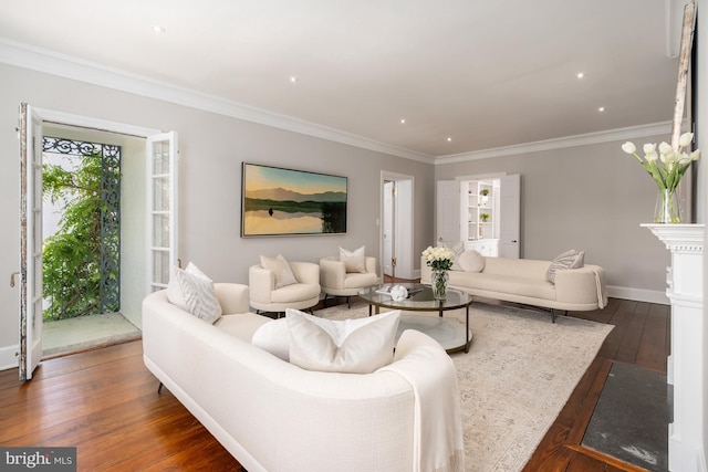 living room featuring ornamental molding and dark wood-type flooring