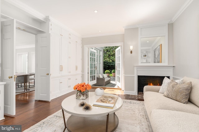 living room with crown molding and dark hardwood / wood-style floors