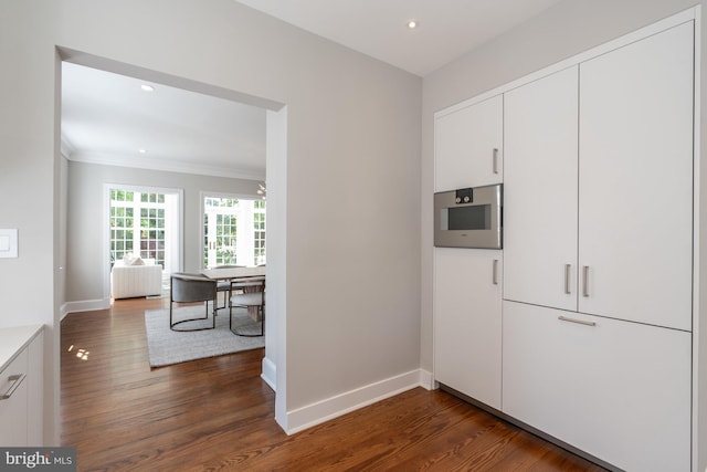 kitchen with white cabinets and dark hardwood / wood-style flooring