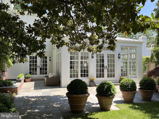 exterior space with french doors and a patio area