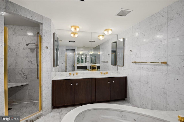 bathroom featuring vanity, tile walls, and tiled shower