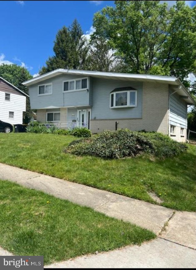 view of front of home with a front yard