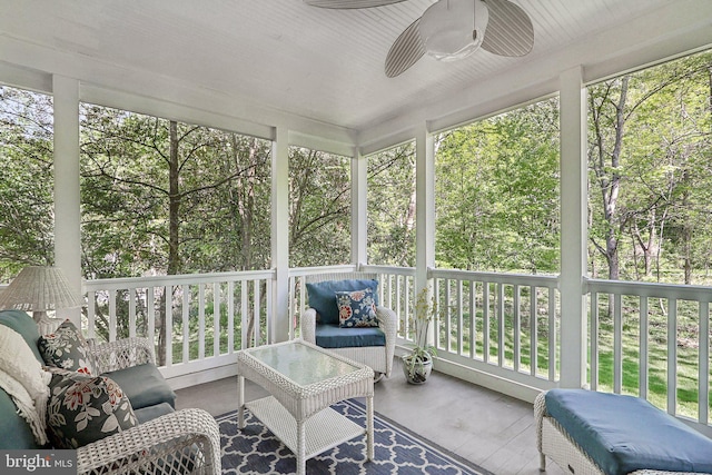 sunroom / solarium with ceiling fan