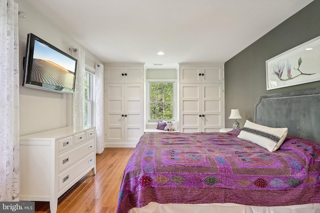 bedroom with light hardwood / wood-style flooring