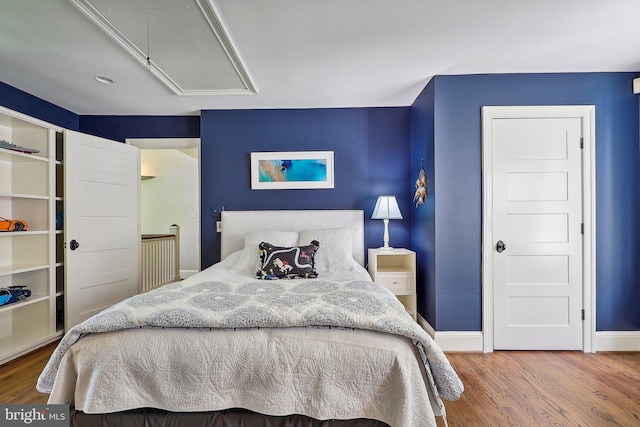 bedroom featuring wood-type flooring