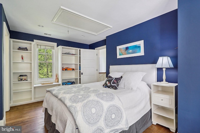 bedroom featuring dark hardwood / wood-style flooring