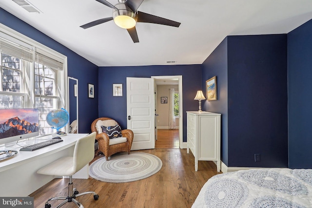 bedroom featuring wood-type flooring and ceiling fan