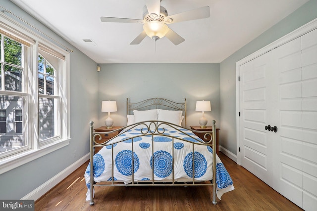 bedroom featuring wood-type flooring and ceiling fan