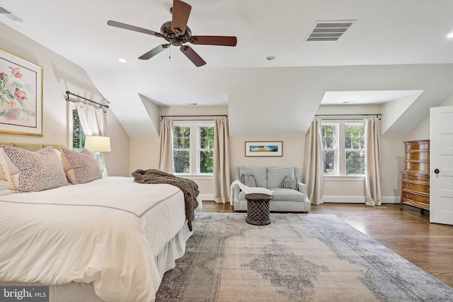 bedroom with lofted ceiling, wood-type flooring, and ceiling fan