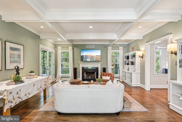 living room with beamed ceiling, dark hardwood / wood-style flooring, coffered ceiling, a high end fireplace, and crown molding