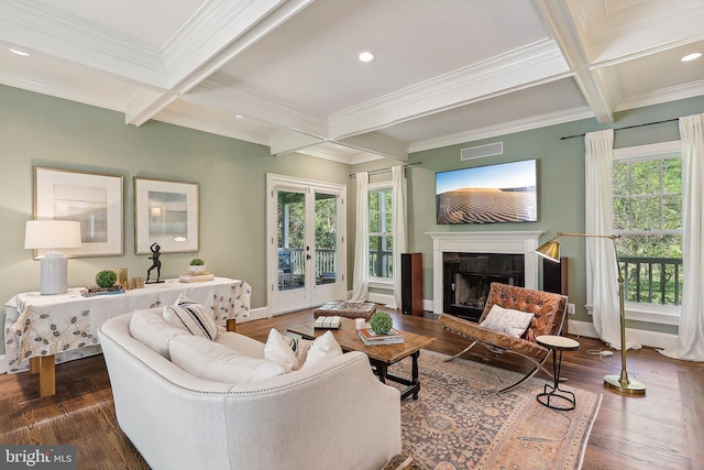 living room with coffered ceiling, a wealth of natural light, and beamed ceiling