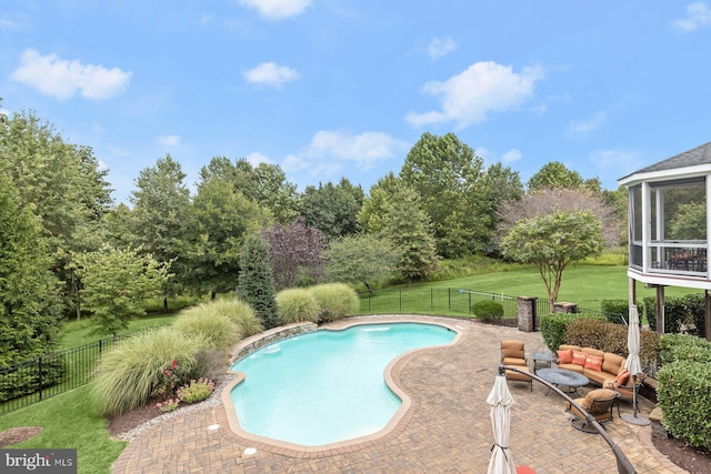 view of swimming pool with a patio area