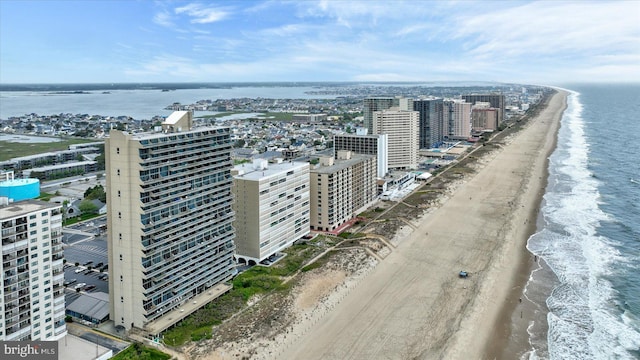 aerial view featuring a view of the beach and a water view