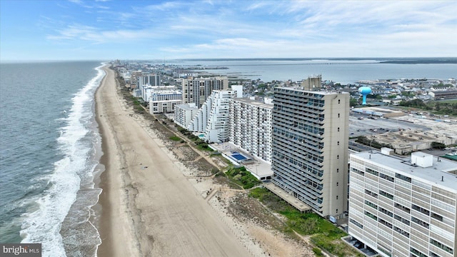 aerial view featuring a water view and a beach view