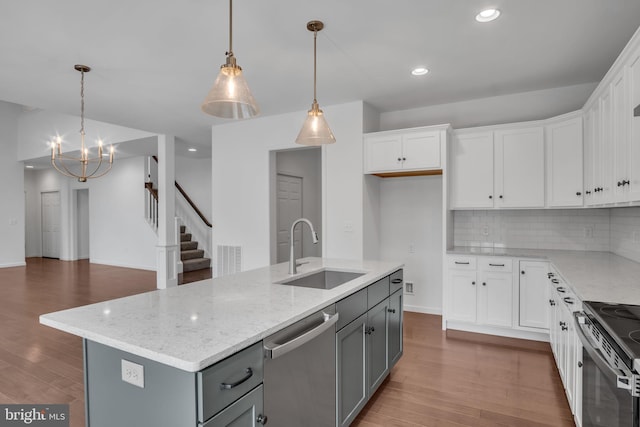 kitchen with a sink and white cabinetry