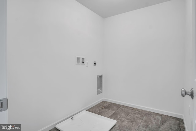 laundry area featuring gas dryer hookup, laundry area, washer hookup, baseboards, and electric dryer hookup