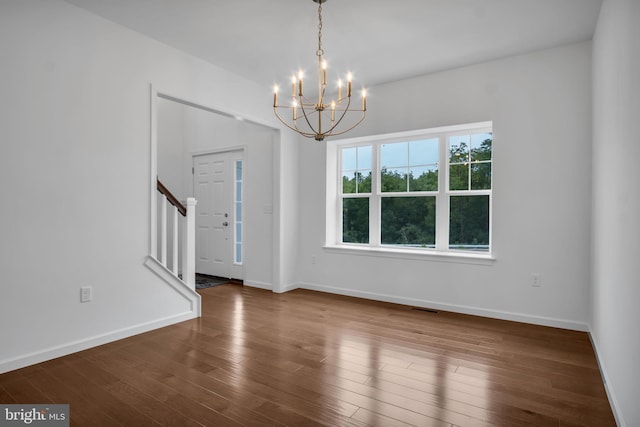 interior space with dark wood-style flooring, visible vents, baseboards, and stairs