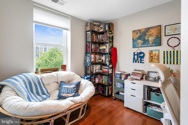 living area featuring hardwood / wood-style floors