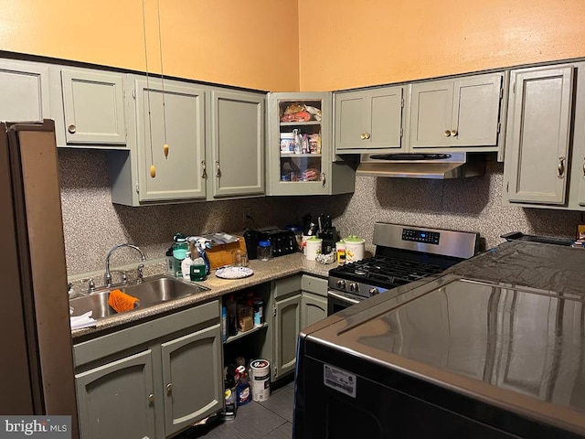 kitchen with gas stove, sink, and extractor fan