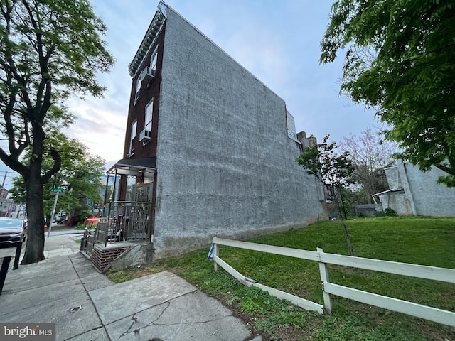 view of home's exterior with a yard