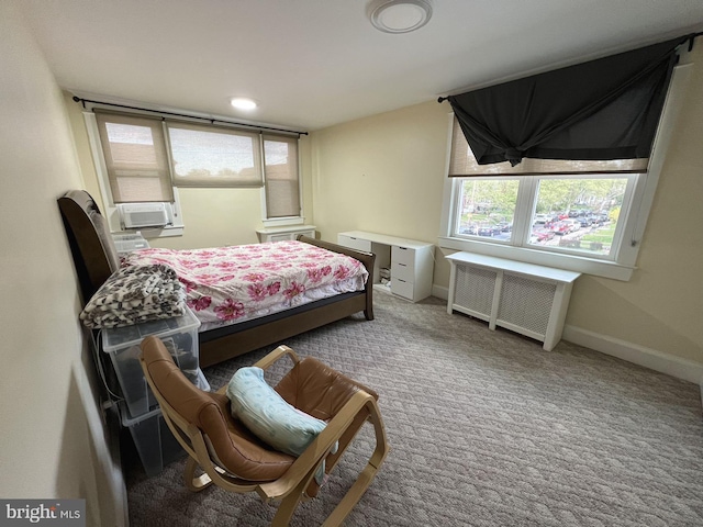 carpeted bedroom featuring radiator heating unit