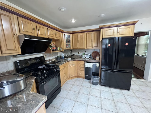 kitchen with dark stone countertops, sink, backsplash, and black appliances