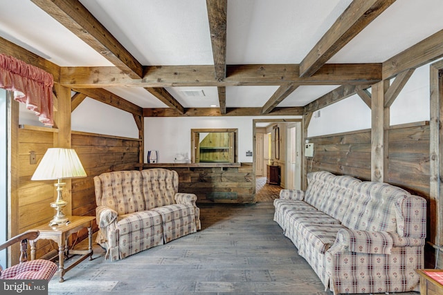 living room with beam ceiling and hardwood / wood-style flooring