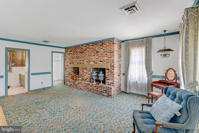 carpeted living room with ornamental molding and a fireplace