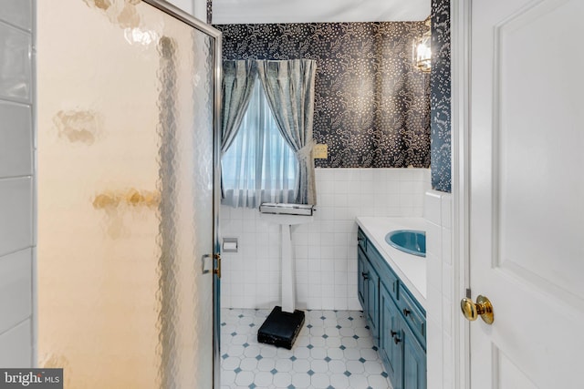 bathroom with vanity, tile flooring, and tile walls