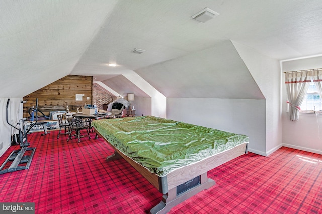 recreation room with a textured ceiling, billiards, vaulted ceiling, and carpet flooring