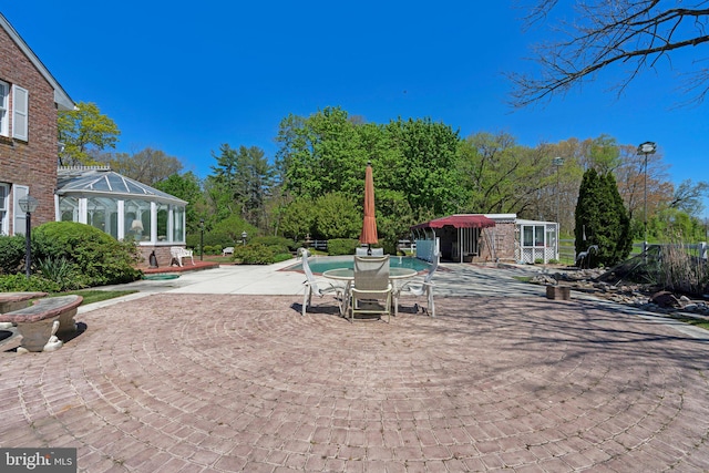 view of patio featuring a pool