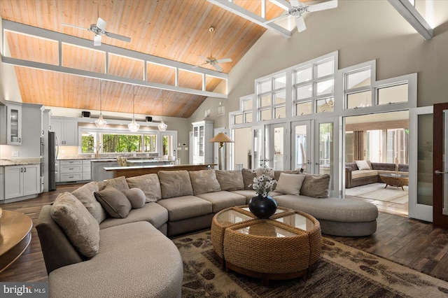 living room with high vaulted ceiling, wooden ceiling, ceiling fan, and hardwood / wood-style flooring