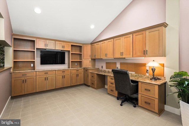 tiled home office with high vaulted ceiling and built in desk