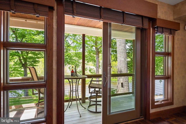 doorway to outside with hardwood / wood-style flooring and plenty of natural light