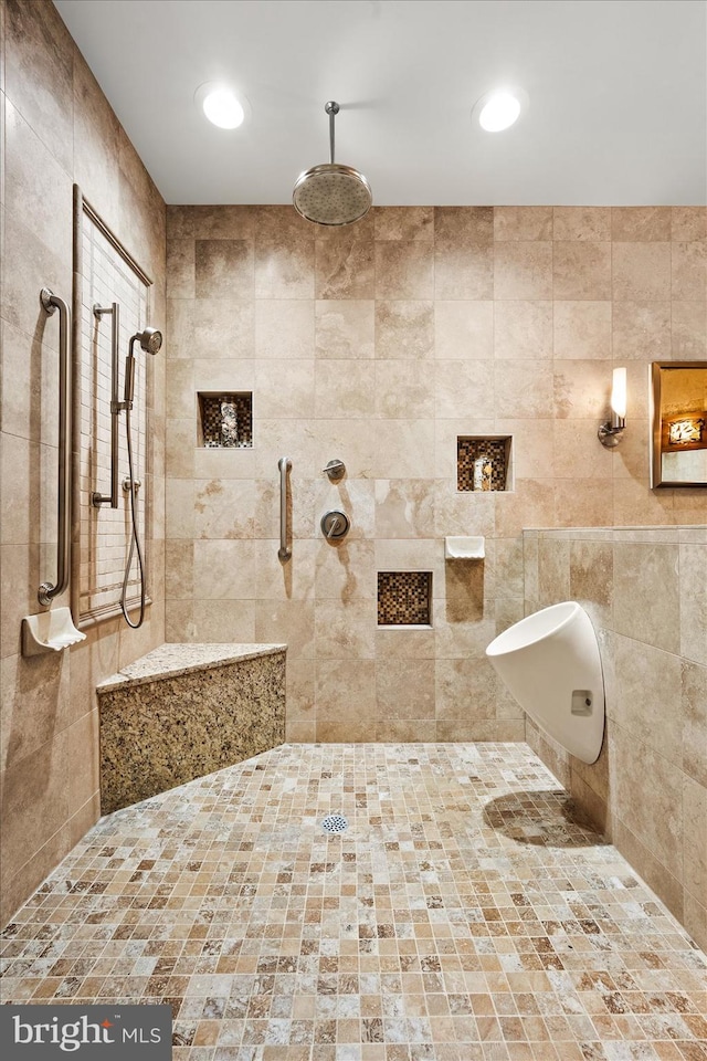 bathroom with a tile shower